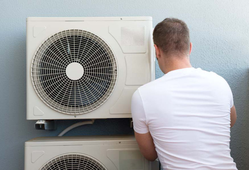 Man Working on Air Conditioner